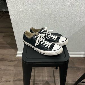 Black low top Chuck Taylor Converse
